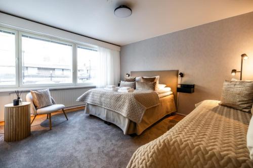 Кровать или кровати в номере Santa's Luxury City Apartment 2
