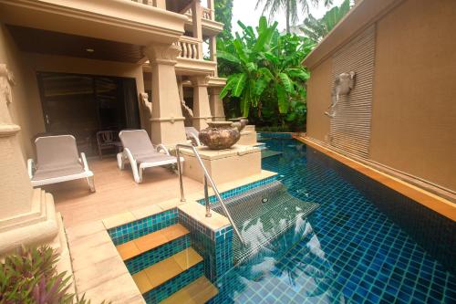 a swimming pool in the backyard of a house at Beyond Kata in Kata Beach
