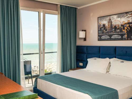 Postel nebo postele na pokoji v ubytování VM Resort & SPA