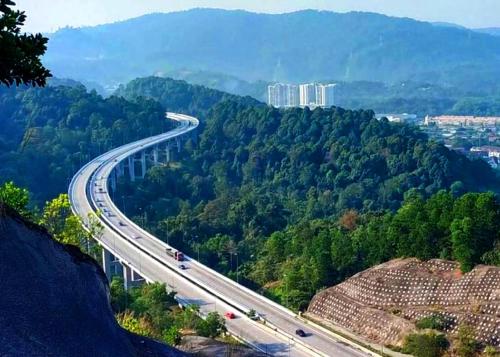 a highway in the mountains with cars on it at ARK Business Rawang hotel in Rawang