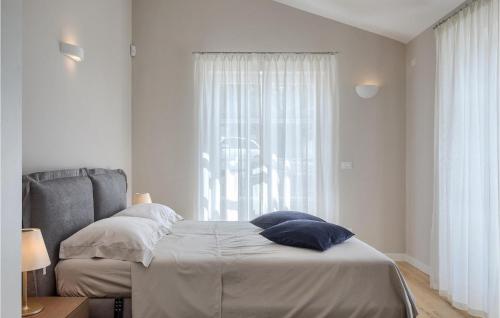 a bedroom with a bed and a window at Villa Julia Marija in Poreč