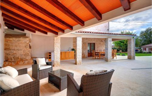 an outdoor patio with a table and chairs at Villa Moncalvo in Rovinj
