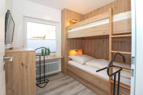 Ένα ή περισσότερα κρεβάτια σε δωμάτιο στο Duenentraum-II