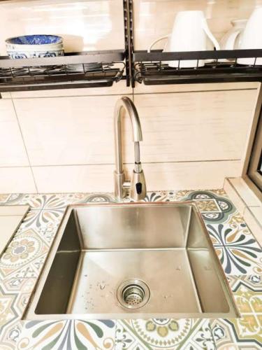 a stainless steel sink in a tiny kitchen at Mossy Forest Family Retreat III, 2-8pax, Sunrise View, Cameron Highlands in Cameron Highlands