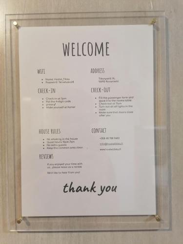 a sign that says welcome and thank you at Hostel Tikka in Rovaniemi