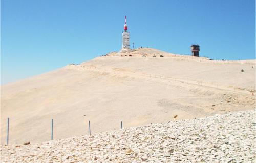 a lighthouse on top of a sand hill at Nice Home In Venasque With Kitchen in Venasque