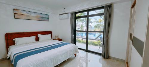Ένα ή περισσότερα κρεβάτια σε δωμάτιο στο Ocean Breeze Apartment Hotel