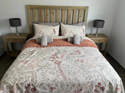a bedroom with a bed with two night stands at City Sanctuary in Windhoek
