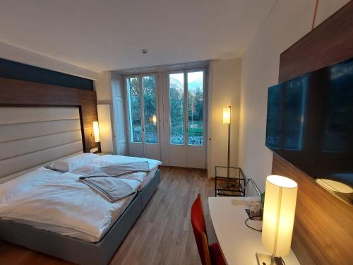Postel nebo postele na pokoji v ubytování Hotel Post Glarnerhof