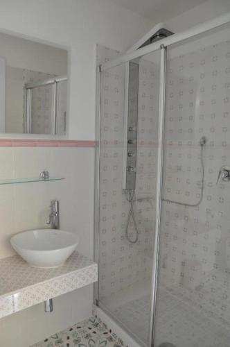 a bathroom with a shower and a sink at SALERNO COSTA D'AMALFI SUITE in Salerno