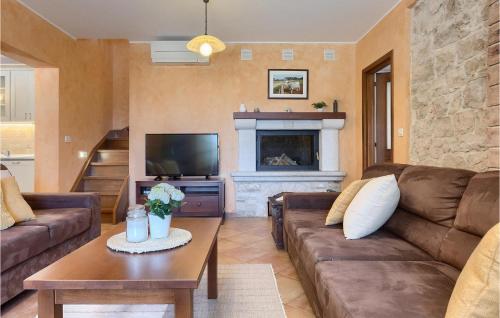 a living room with a couch and a fireplace at Villa Marasi in Poreč