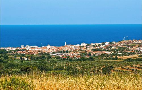a town on a hill next to the ocean at Stunning Home In Monterotondo Marittimo in Monterotondo