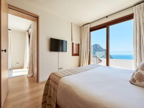 Ένα ή περισσότερα κρεβάτια σε δωμάτιο στο Villa in Ibiza near Sol den Serra Beach