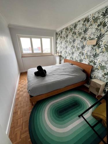 Ένα ή περισσότερα κρεβάτια σε δωμάτιο στο Appartement spacieux à 5 min de Paris