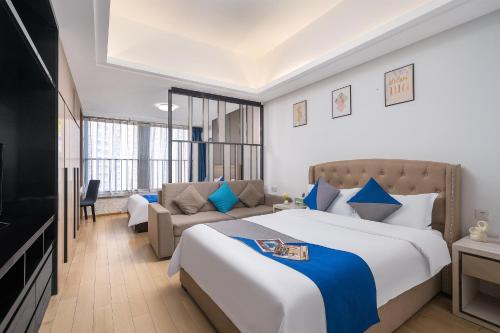 Postel nebo postele na pokoji v ubytování Hantao AI Select International Apartment