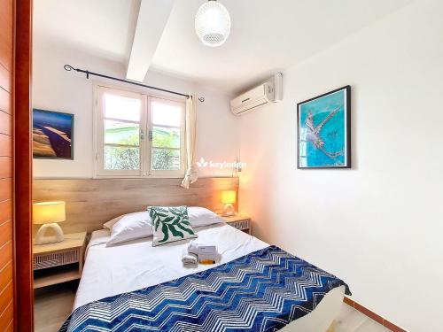 Ένα ή περισσότερα κρεβάτια σε δωμάτιο στο Casa Marine - F3 80m2 avec Jacuzzi - Saint-Paul
