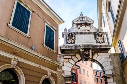 an entrance to a building with an arch in a city at Apartments Regent 2 in Rovinj