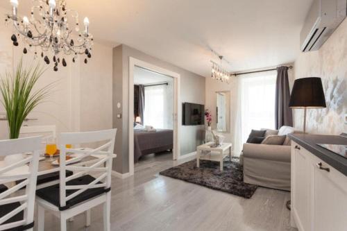 a living room with a couch and a table at Apartments Regent 2 in Rovinj
