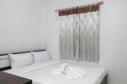 Postel nebo postele na pokoji v ubytování Taw Win Place