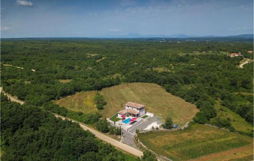 an aerial view of a house on a hill with a pool at Villa Lena in Sarići