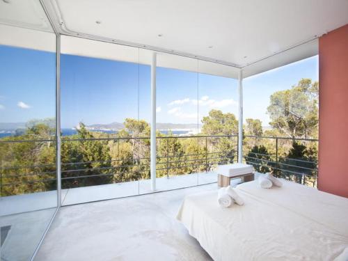Ένα ή περισσότερα κρεβάτια σε δωμάτιο στο Villa in Ibiza near Beaches