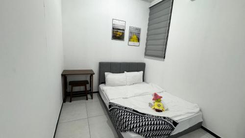 a small bedroom with a bed with a rubber duck on it at 22 Urban Suites #Georgetown #NEW #TopFacilities in Jelutong