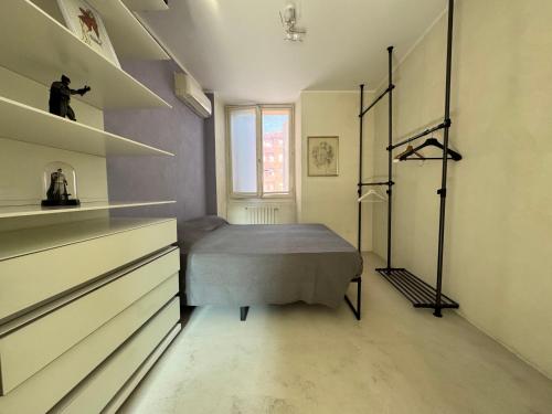 Postel nebo postele na pokoji v ubytování La casa di Wayne
