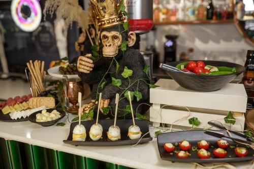 a buffet of food with a skeleton on a table at Luff Living - Adult Only 12 Plus in Antalya