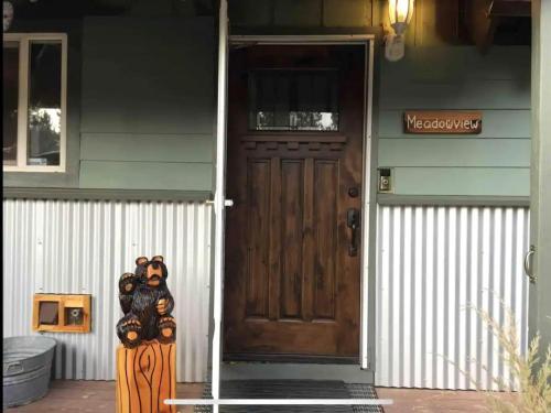 a front door of a house with a wooden door at Spacious family home on the Meadow Monthly Only in South Lake Tahoe