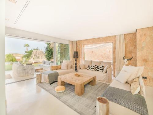a living room with a couch and a table at Villa in Ibiza near Cala Conta Beach in Cala Comte