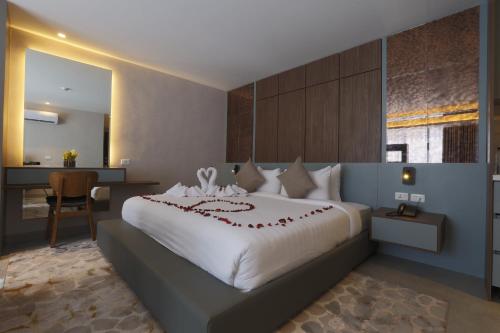 Postel nebo postele na pokoji v ubytování G Hotel Amman