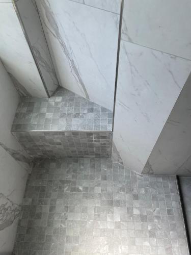 a staircase in a bathroom with a tiled floor at Little Milan - LM2 - LM3 - LM4 in Milan