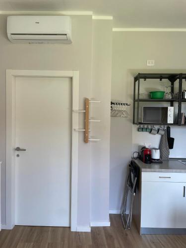 a white door in a kitchen with a counter at Little Milan - LM2 - LM3 - LM4 in Milan
