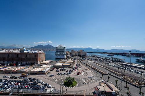 a parking lot with a cruise ship in the water at Mia Suites Hotel Bella Capri in Naples