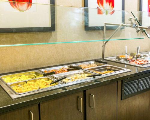 a buffet line with many different types of food at Cambria Hotel Denver International Airport in Aurora