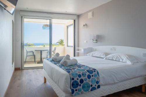 Postel nebo postele na pokoji v ubytování Hôtel Beau Site