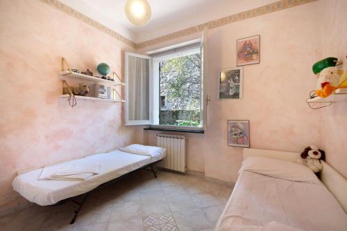 Cama o camas de una habitación en Via Daneri 2 con giardino