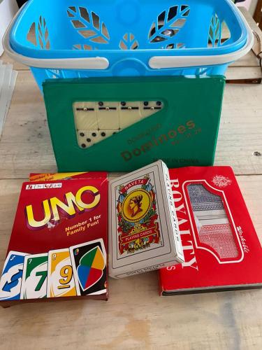a table with a nintendo wii game system and a box at Cabañas Entrearomos 1 in Panguipulli
