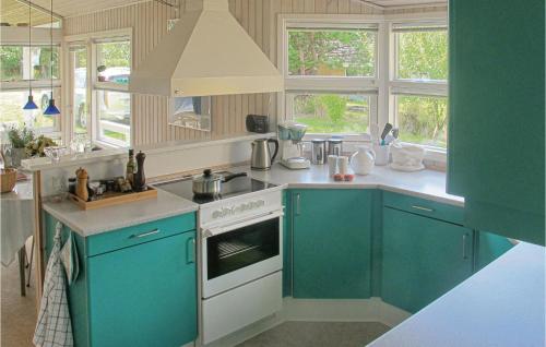Η κουζίνα ή μικρή κουζίνα στο Holiday Home Fridavej Grenaa Vi