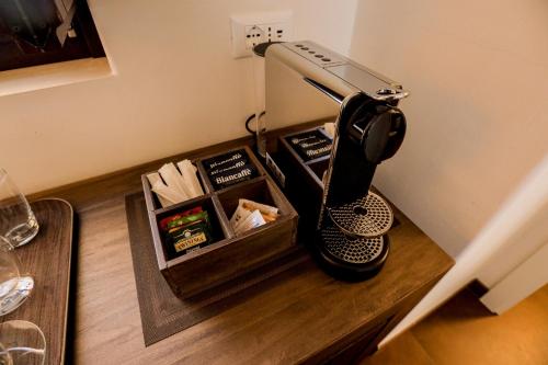 a hair dryer sitting on top of a wooden table at Ddò Relais di Puglia in Ostuni