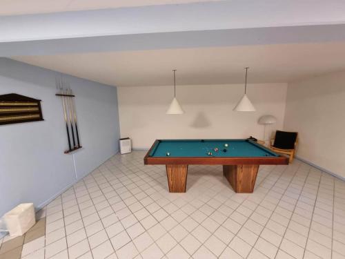 a room with a pool table in it at 4 star holiday home in Kalvehave in Kalvehave