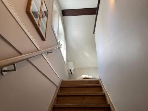 a staircase in a house with a stair case at 4 person holiday home in Frändefors in Frändefors