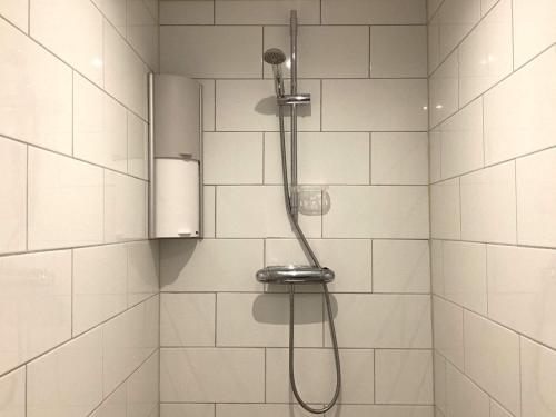 a shower with a shower head in a bathroom at 4 person holiday home in Frändefors in Frändefors