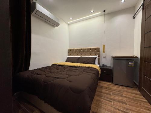 Postel nebo postele na pokoji v ubytování New White Pyramids Inn