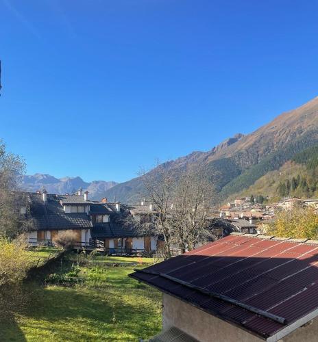 a view of a village with solar panels on the roof at Pink Grumello in Schilpario