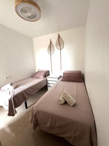 a bedroom with two beds and a window at Bol02 - Modern 2 bedroom apartment in Bolnuevo in Bolnuevo