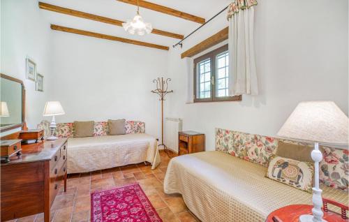 a living room with two beds and a couch at Villa I Cedri in Santa Lucia