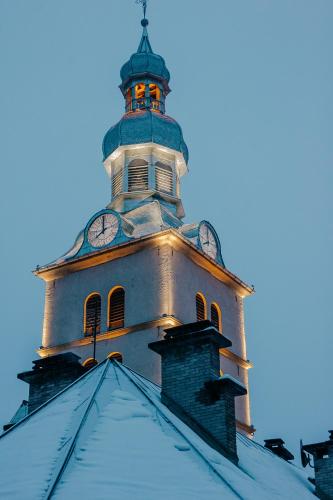 a clock tower on top of a building at Coeur de Megève in Megève