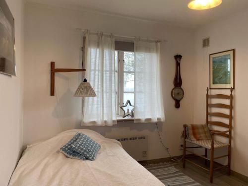 a bedroom with a bed and a window at 4 star holiday home in Åmål in Åmål