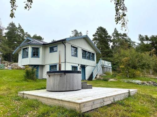 a house with a wooden ramp in front of it at 4 star holiday home in Åmål in Åmål